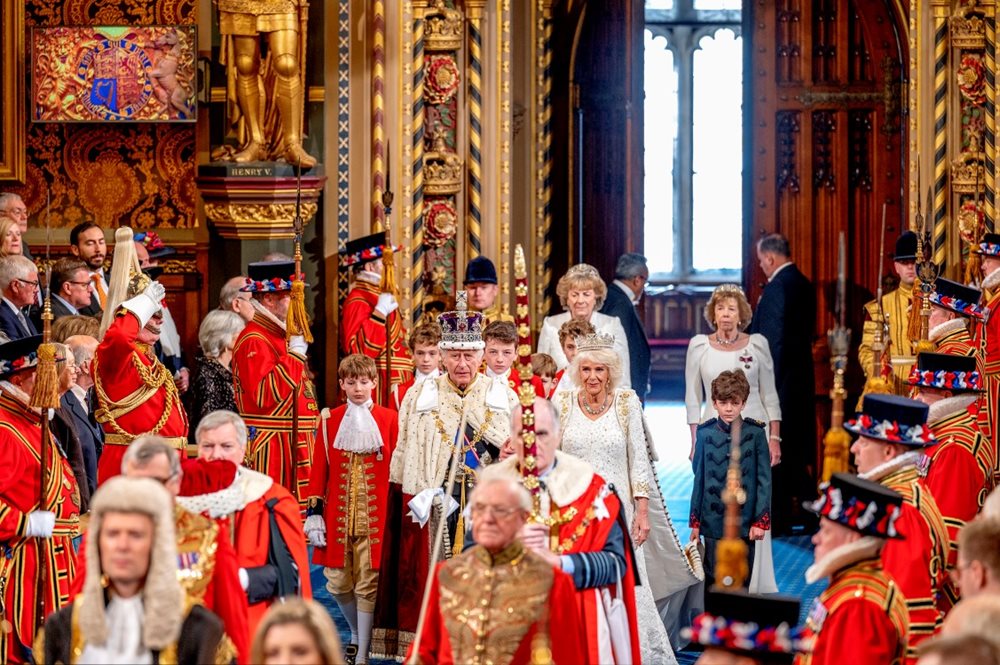 The King and Queen process through the Royal Gallery of the House of Lords