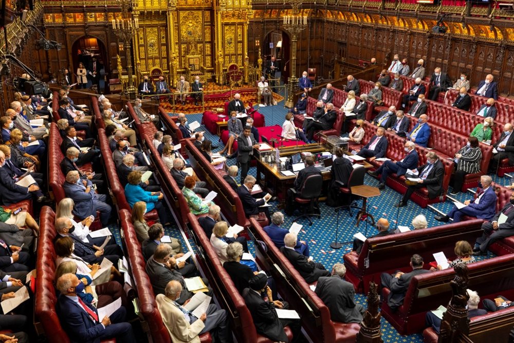 House of Lords chamber with members sat on the red benches during business