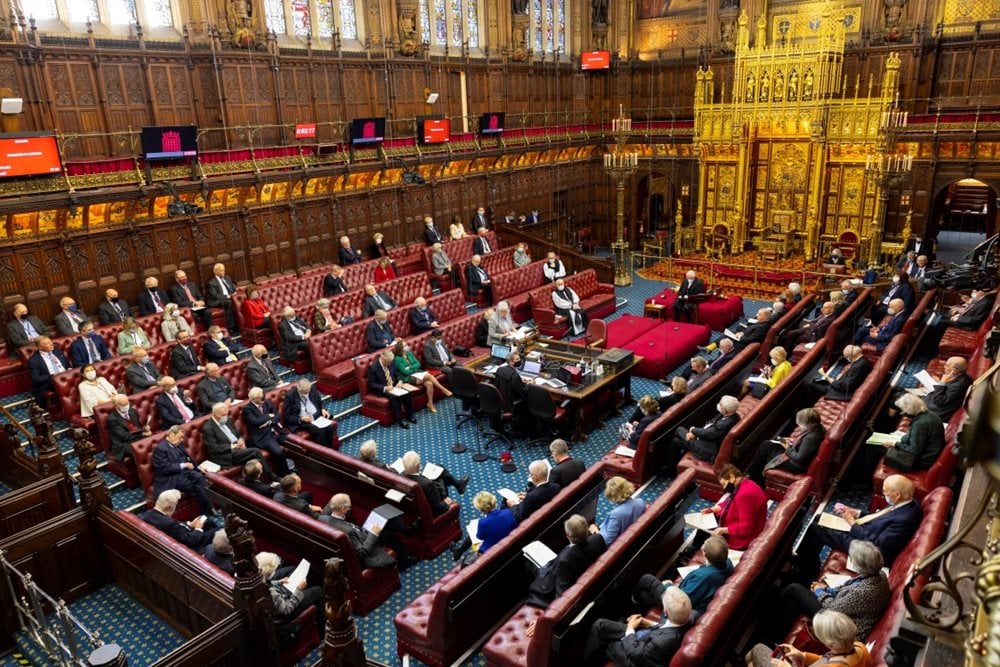 The House of Lords chamber from above with members sat on the red benches