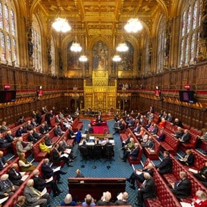 A busy House of Lords chamber looking towards the throne